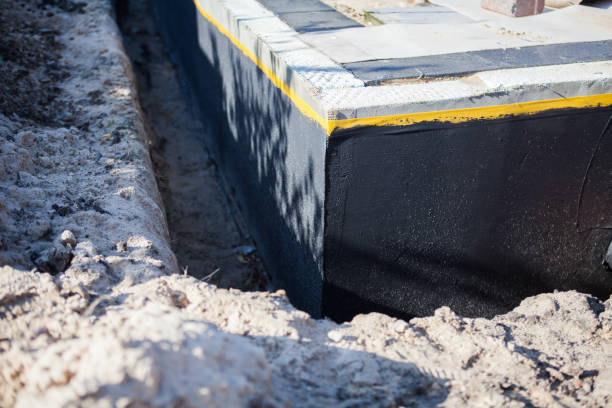 Professional Waterproofing technician working in Malcolm, AL